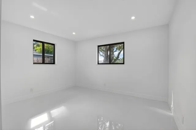 an empty room with windows