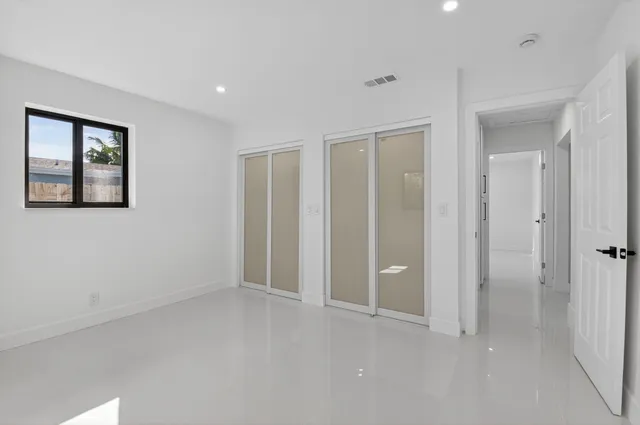 wooden floor and windows in an empty room