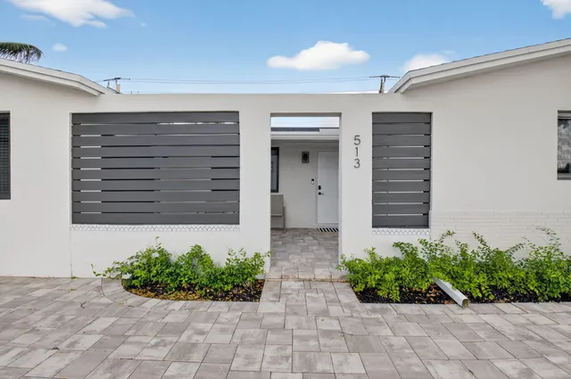 a kitchen with stainless steel appliances white cabinets and a sink