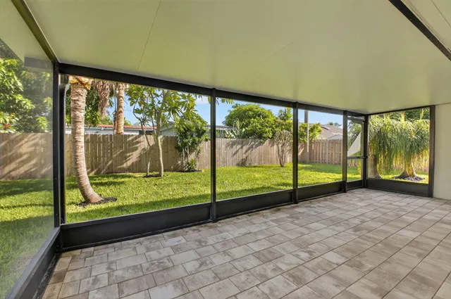 a view of a garden with an outdoor seating