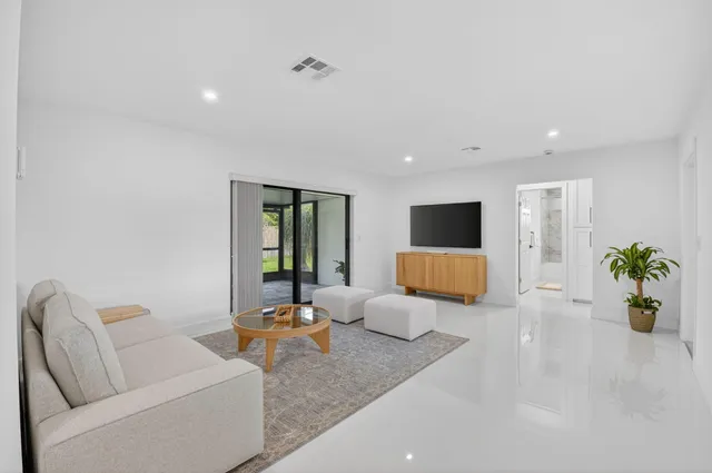a living room with furniture and a table