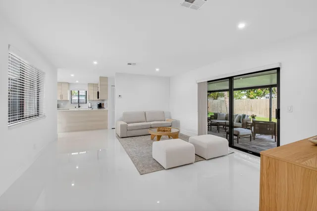 a view of a dining room with furniture and window