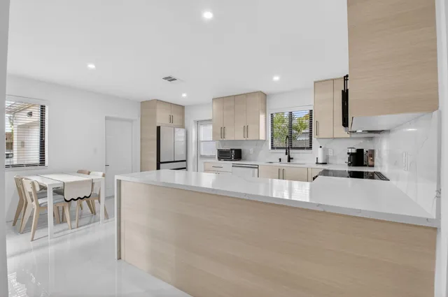 a bedroom with a bed and a mirror