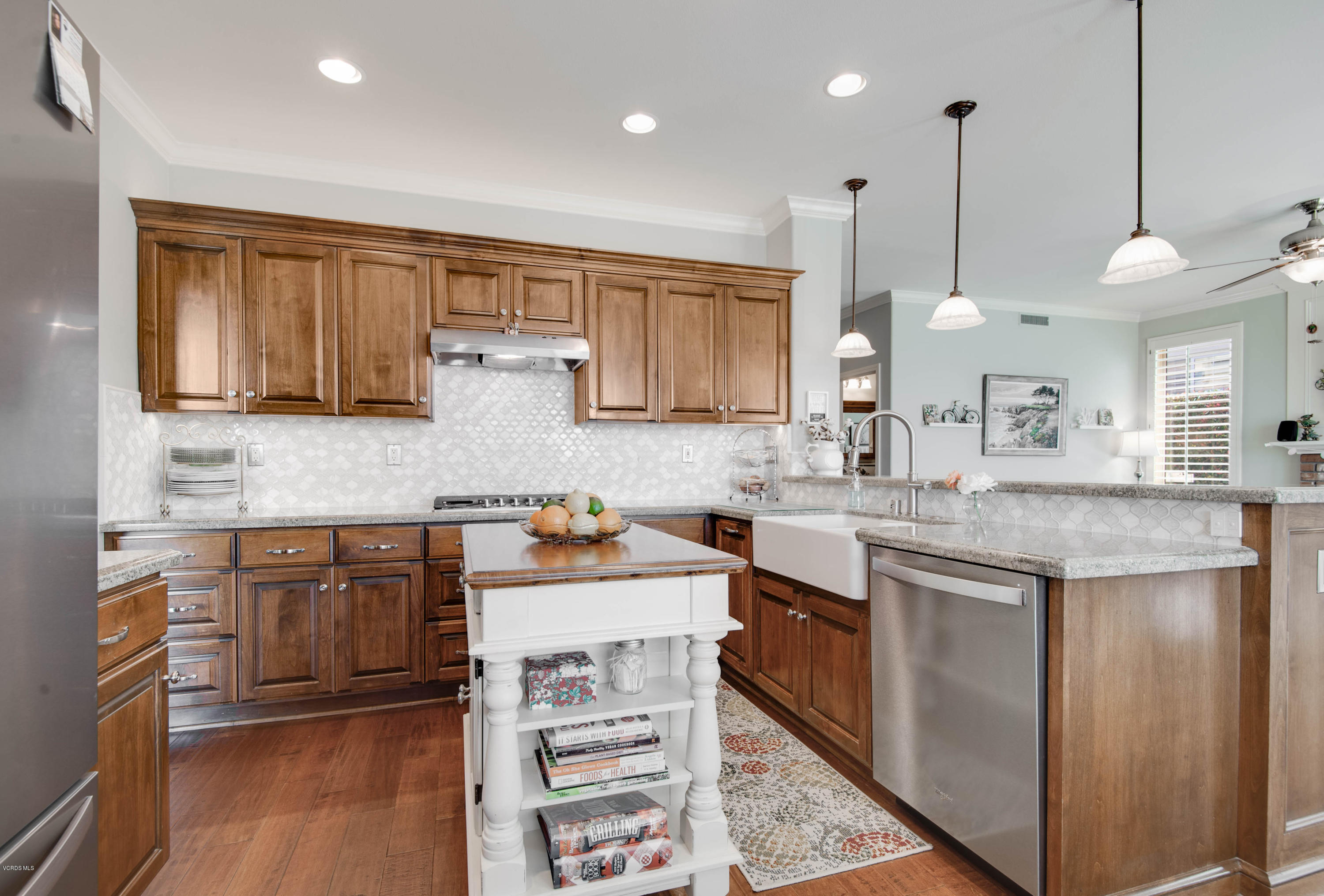 2452 Gillingham Circle Thousand Oaks, CA 91362 - Photo 11 of 43 a kitchen with a sink stove and cabinets