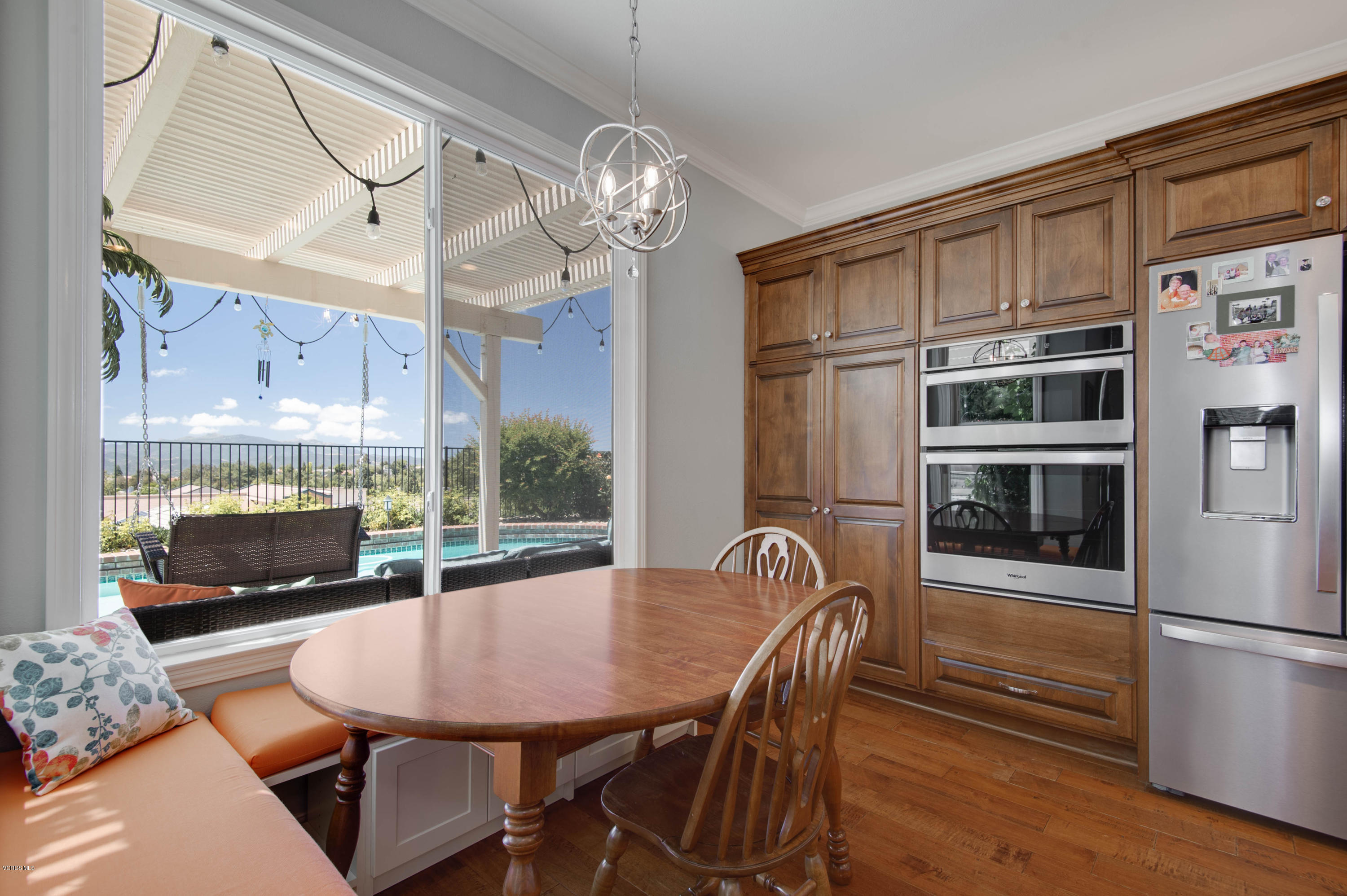 2452 Gillingham Circle Thousand Oaks, CA 91362 - Photo 13 of 43 a view of a dining room with furniture a chandelier and wooden floor