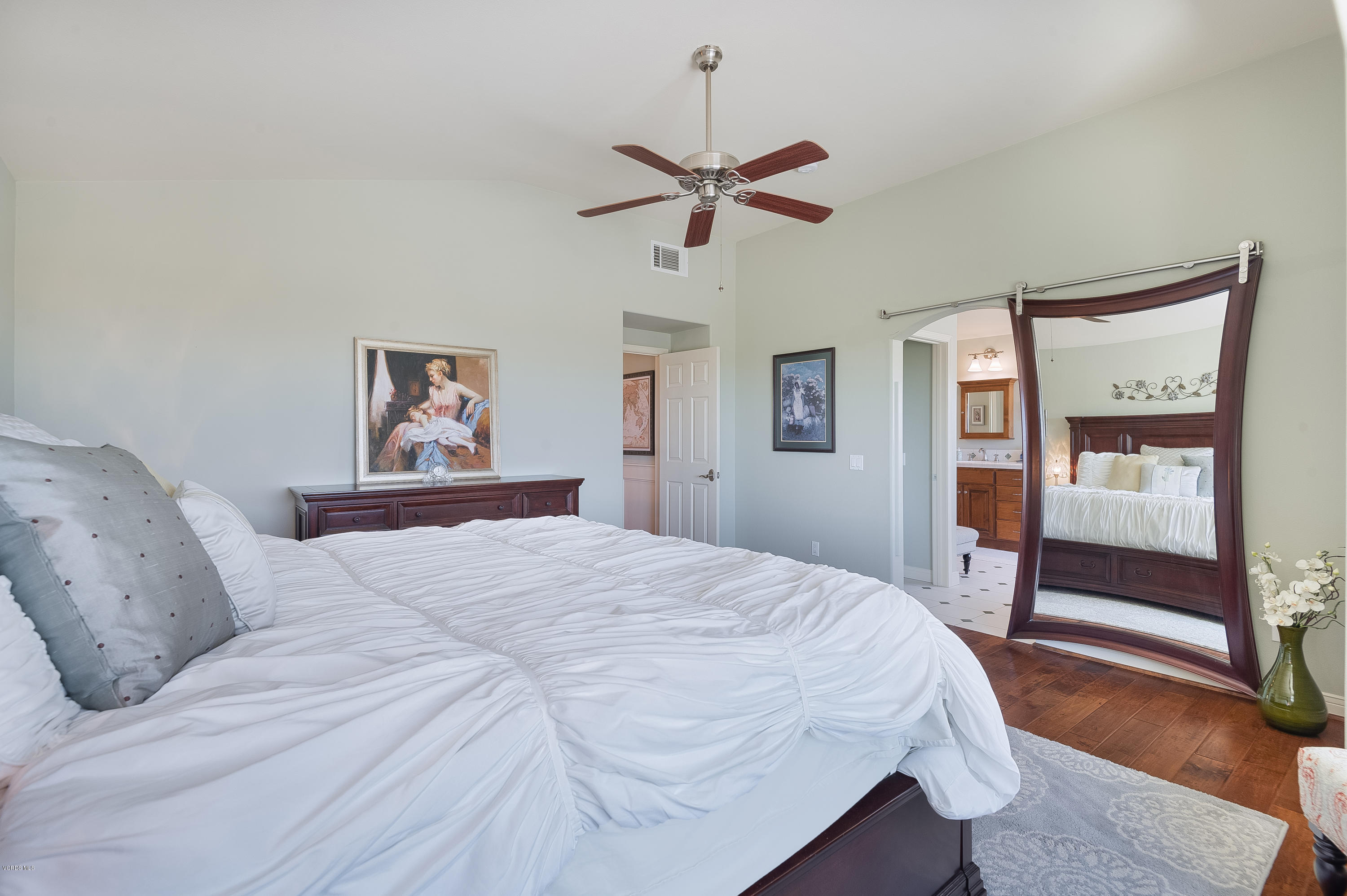 2452 Gillingham Circle Thousand Oaks, CA 91362 - Photo 23 of 43 a bedroom with a large bed and a chandelier