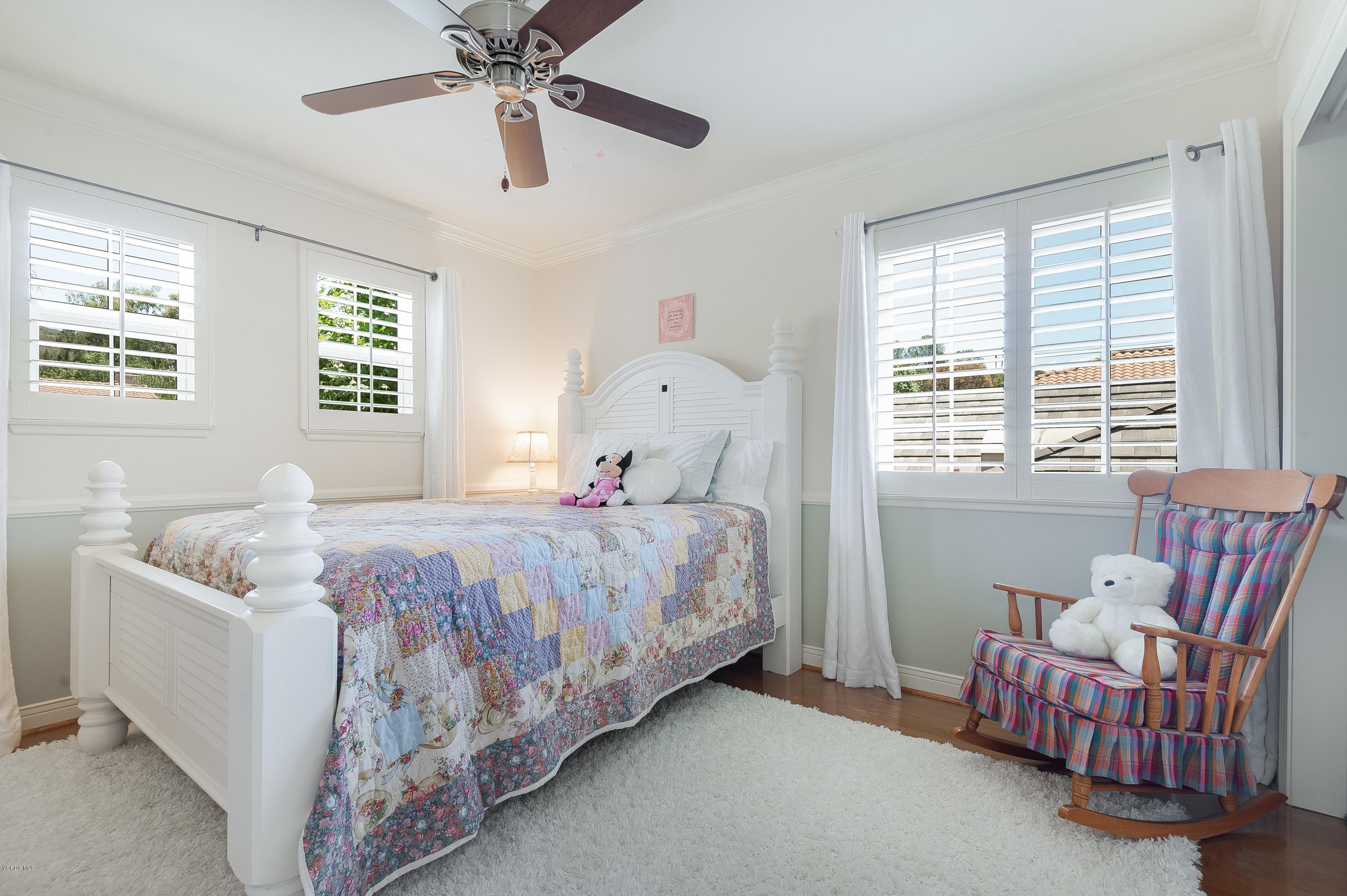 2452 Gillingham Circle Thousand Oaks, CA 91362 - Photo 30 of 43 a bedroom with a bed and a chandelier