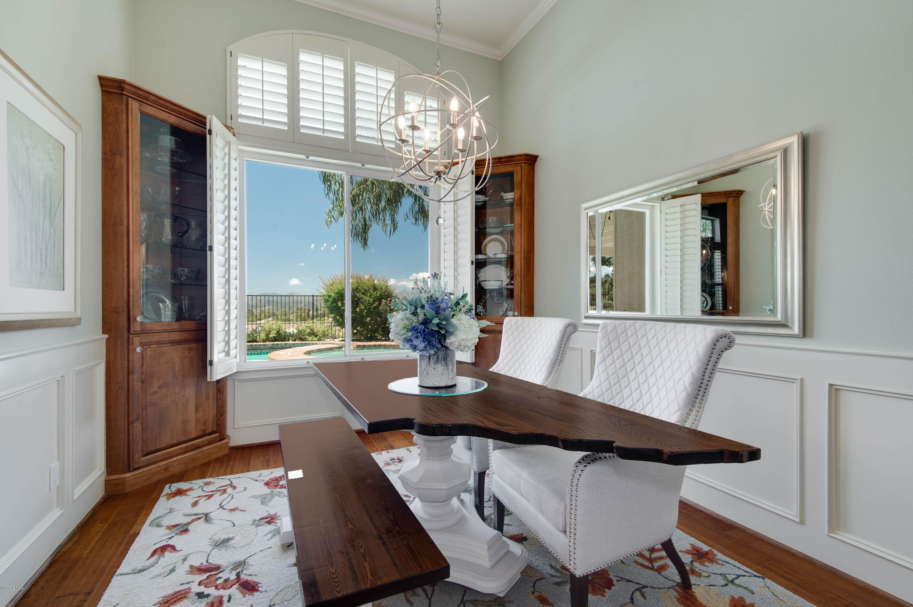 2452 Gillingham Circle Thousand Oaks, CA 91362 - Photo 10 of 43 a view of a dining room with furniture wooden floor and chandelier