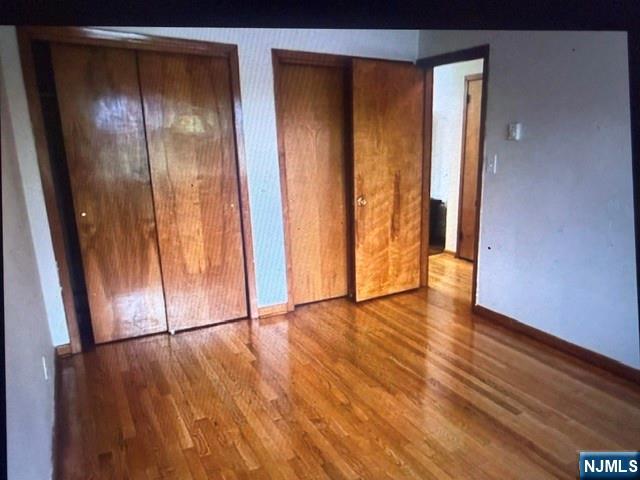 490 Union Avenue Rutherford, NJ 07070 - Photo 7 of 11 an empty room with wooden floor and entrance