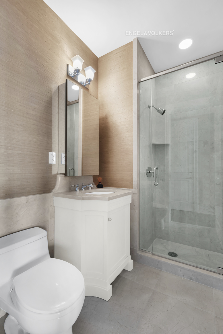 Undisclosed Address Manhattan, NY 10023 - Photo 14 of 23 a bathroom with a sink toilet and shower