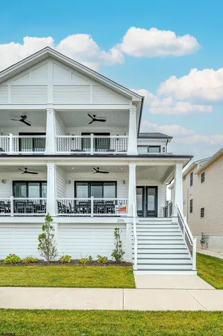a view of a white building with a swimming pool