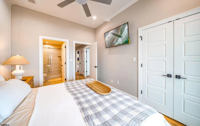 a bedroom with a bed and a lamp