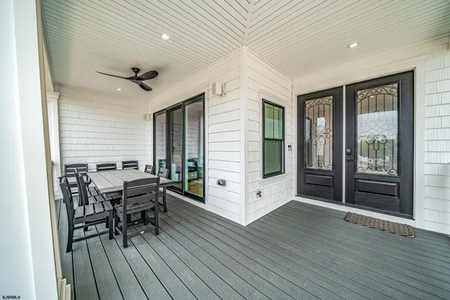 a view of a livingroom with furniture and hardwood floor