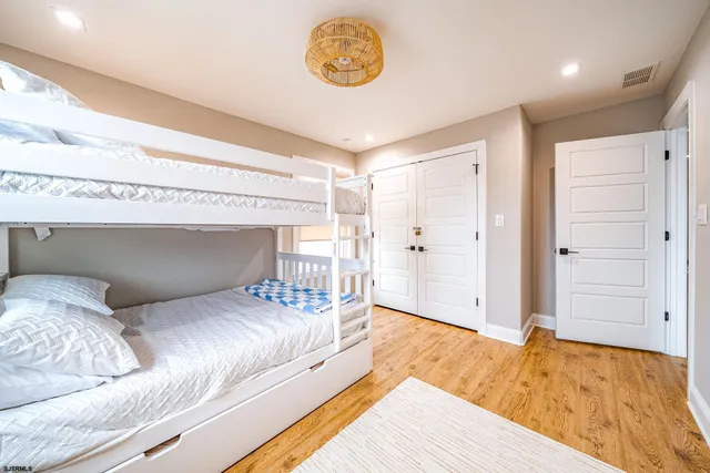 a bedroom with a bed and a table