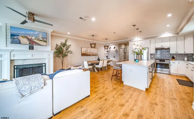 a living room with fireplace furniture and a flat screen tv