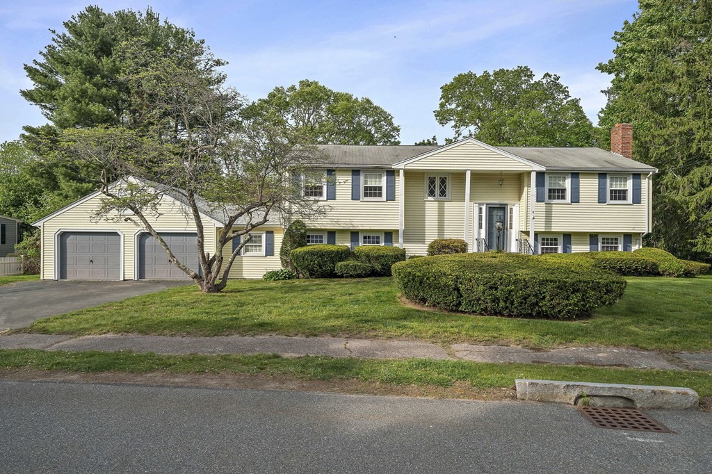 11 Old Coach Road Canton, MA 02021 - Photo 1 of 33 a front view of a house with a garden
