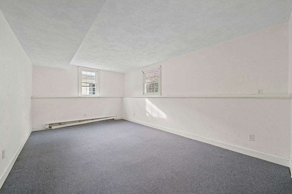 11 Old Coach Road Canton, MA 02021 - Photo 25 of 33 an empty room with a empty space and windows
