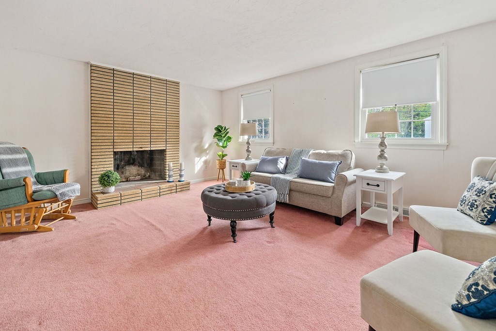 11 Old Coach Road Canton, MA 02021 - Photo 4 of 33 a living room with furniture and a fireplace