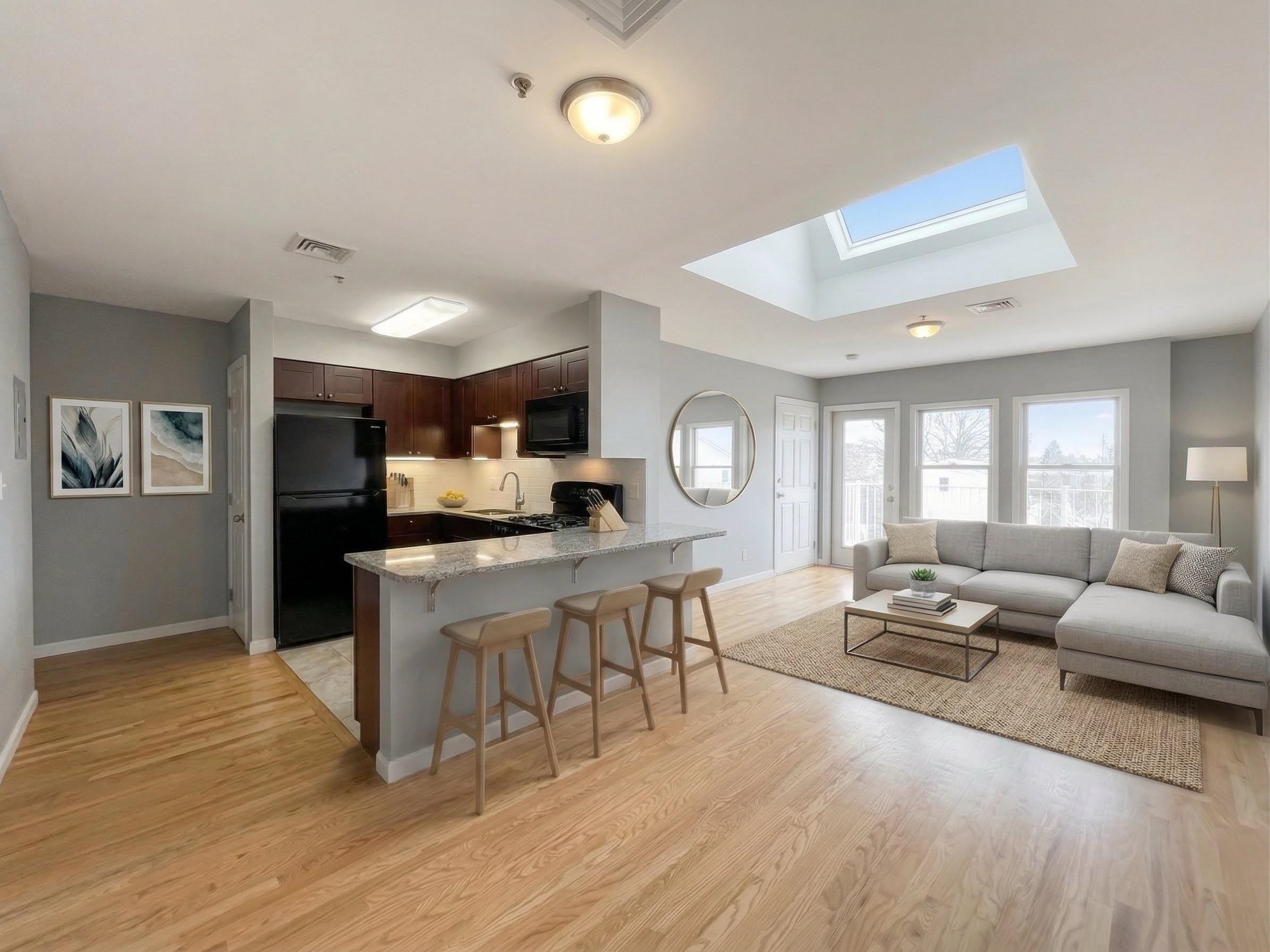 420 6th Street, Unit 3 Union City, NJ 07087 - Photo 1 of 12 a living room with furniture a wooden floor and a fireplace