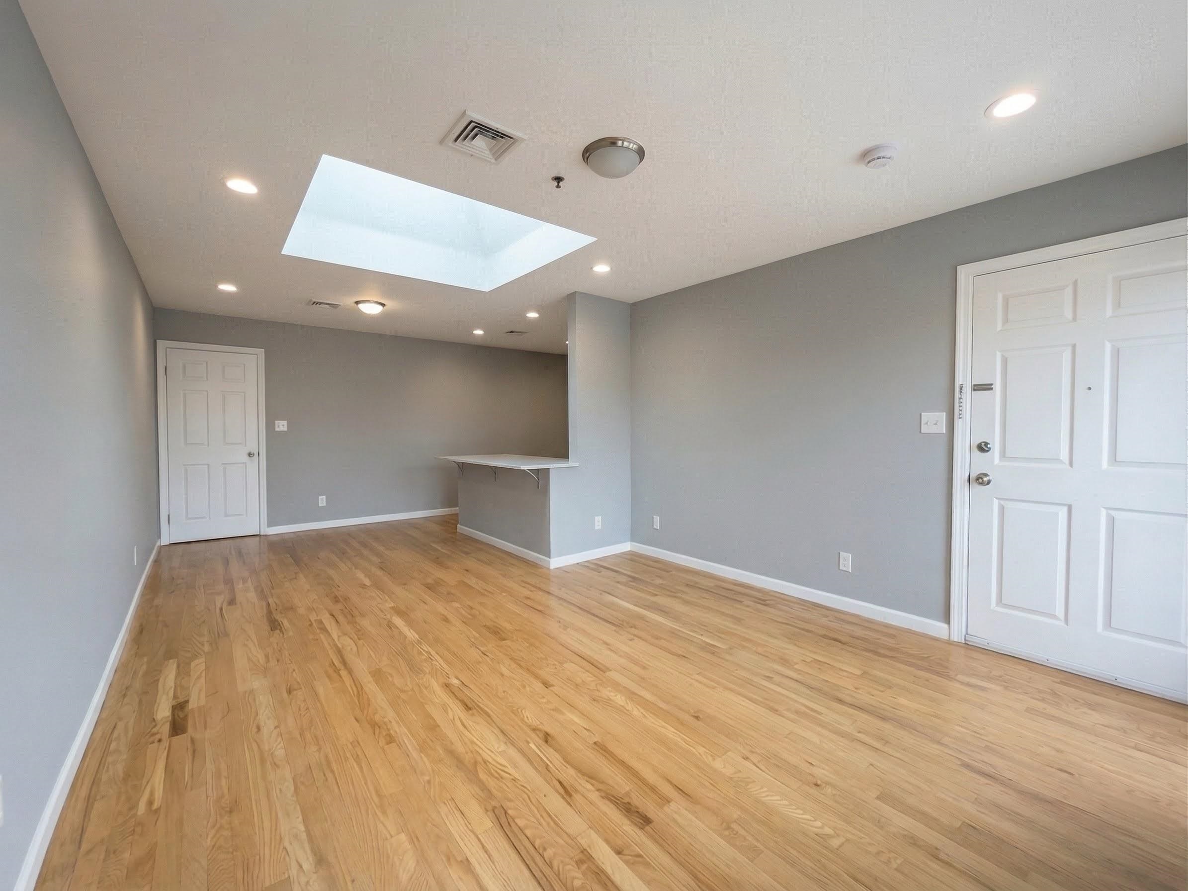 420 6th Street, Unit 3 Union City, NJ 07087 - Photo 2 of 12 a view of an empty room and wooden floor