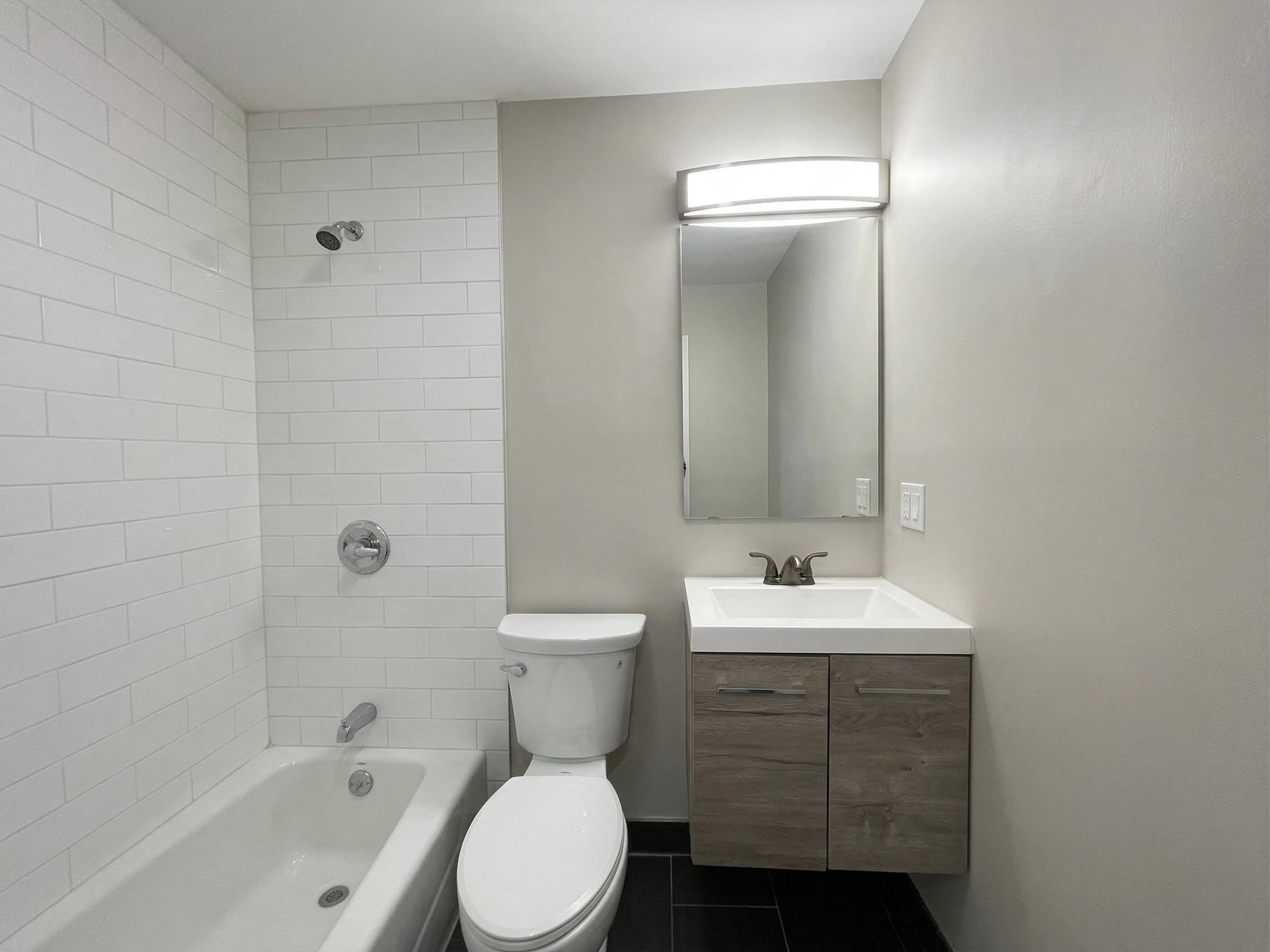 420 6th Street, Unit 3 Union City, NJ 07087 - Photo 10 of 12 a bathroom with a sink toilet and shower
