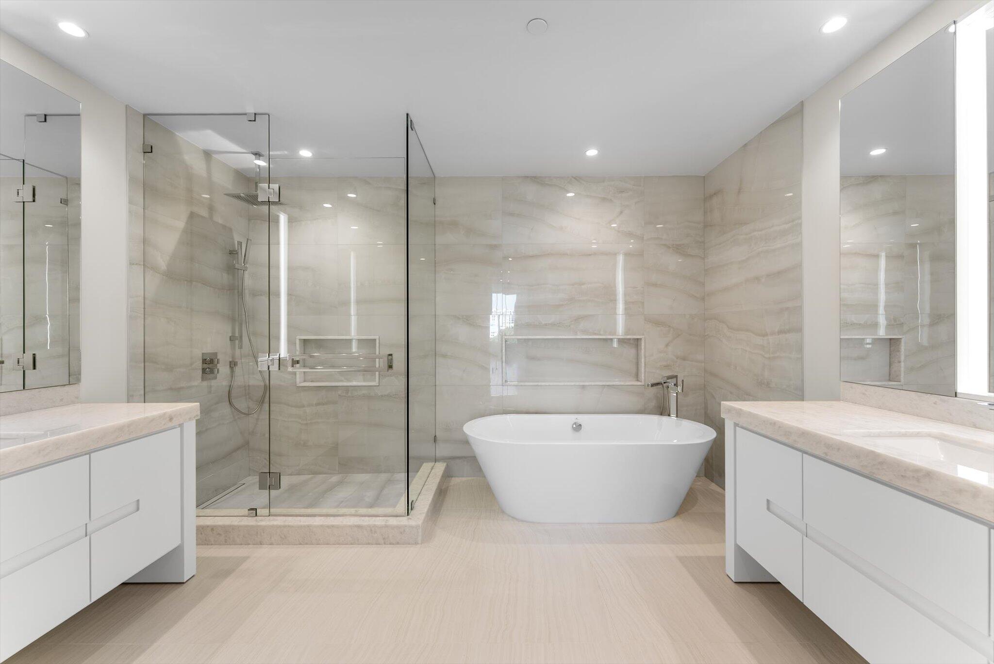220 Southeast Mizner Boulevard, Unit 609 Boca Raton, FL 33432 - Photo 28 of 63 a bathroom with a bathtub shower sink mirror and toilet