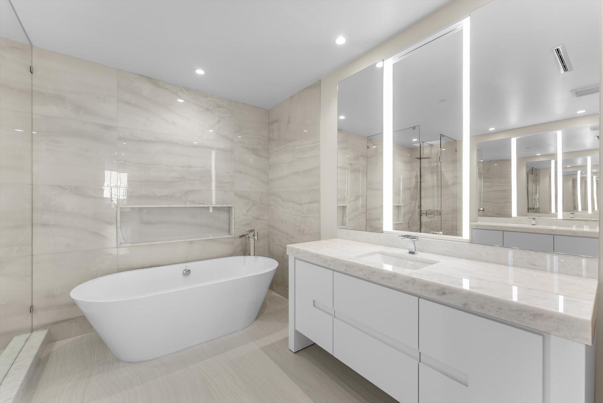 220 Southeast Mizner Boulevard, Unit 609 Boca Raton, FL 33432 - Photo 29 of 63 a bathroom with a bathtub and a sink