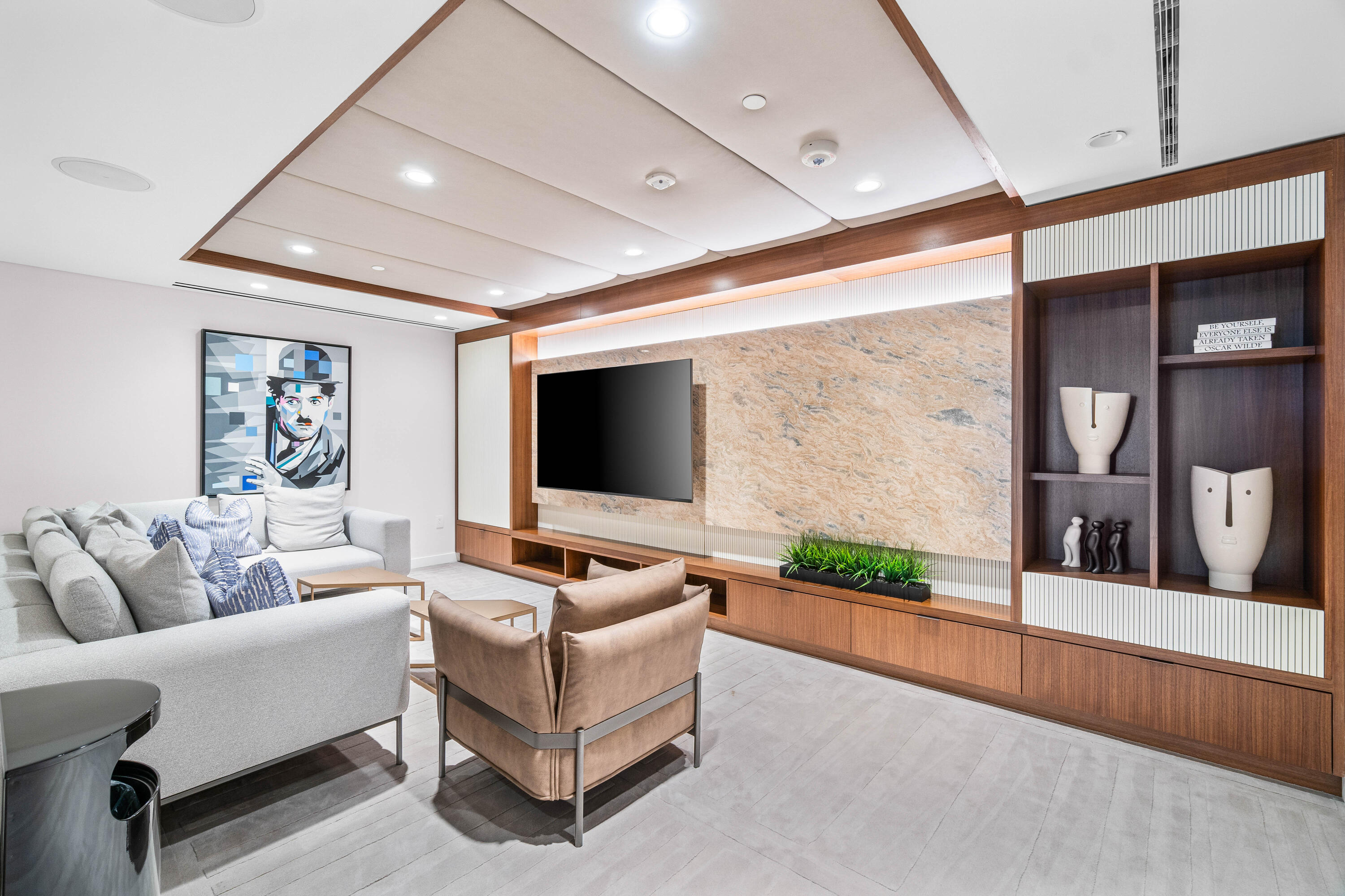 220 Southeast Mizner Boulevard, Unit 609 Boca Raton, FL 33432 - Photo 53 of 63 a living room with furniture and a flat screen tv