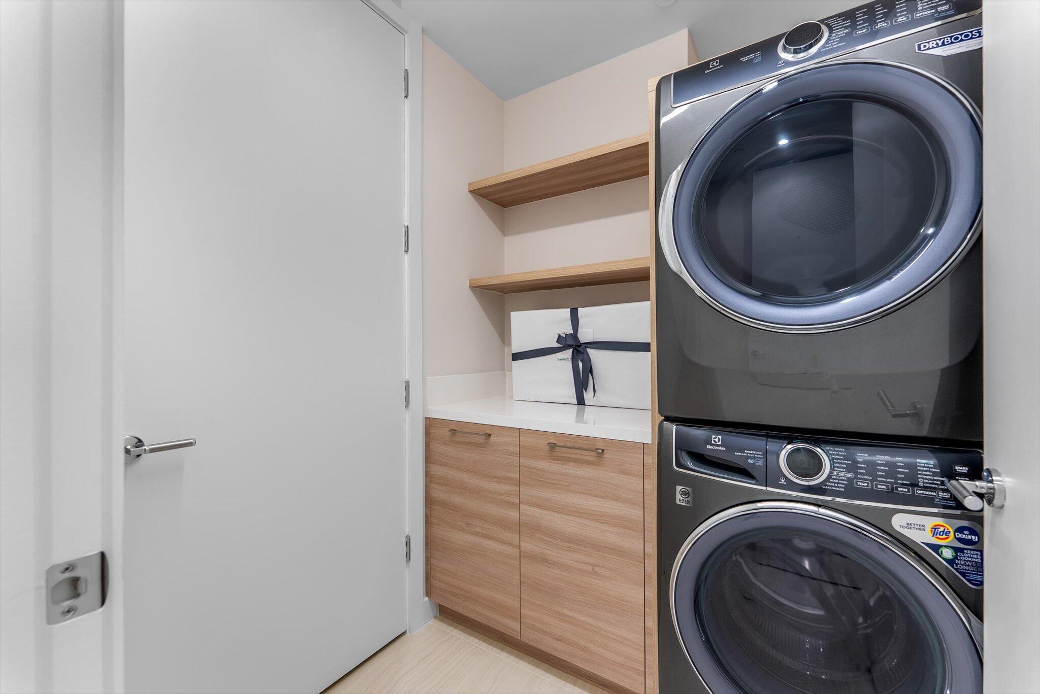 220 Southeast Mizner Boulevard, Unit 609 Boca Raton, FL 33432 - Photo 6 of 63 a close up view of a washer and dryer