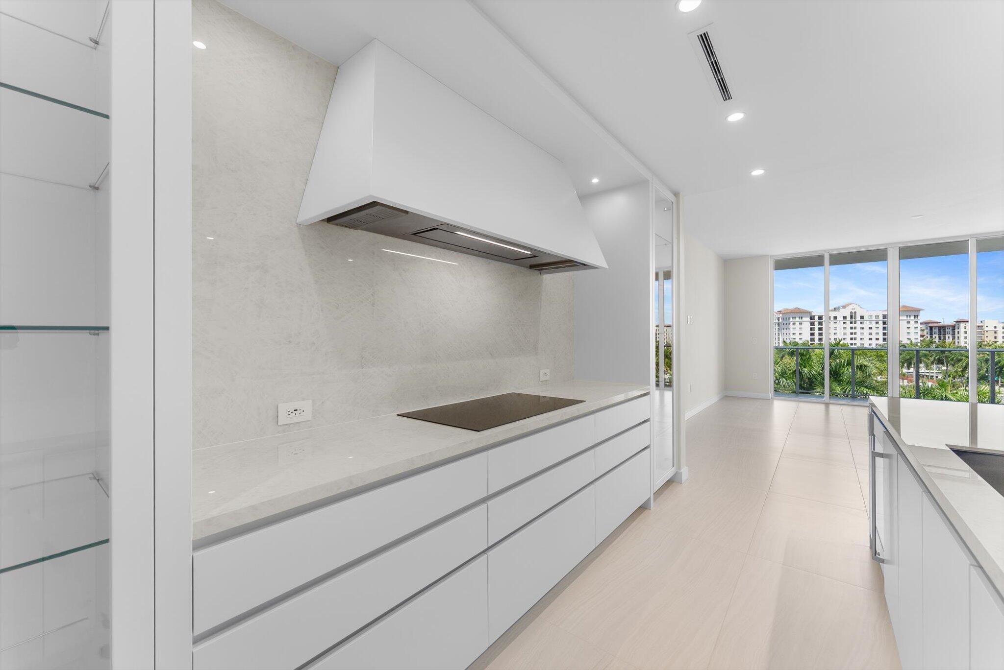 220 Southeast Mizner Boulevard, Unit 609 Boca Raton, FL 33432 - Photo 10 of 63 a bathroom with a tub and a shower