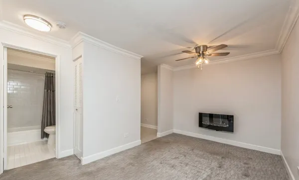 a kitchen with stainless steel appliances granite countertop white cabinets and a stove a oven with white countertops