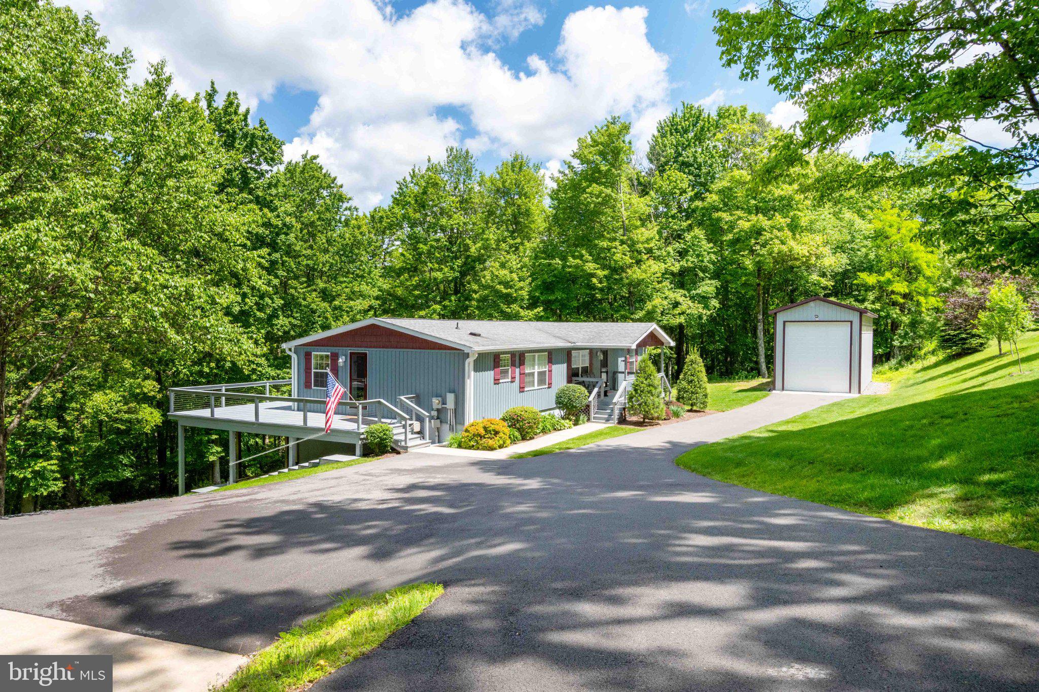 511 Hill Top Road Oakland, MD 21550 - Photo 2 of 51 Charming home nestled in lush greenery.