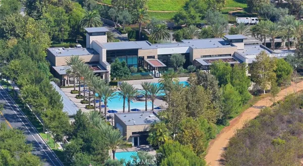 an aerial view of a house with outdoor space and street view
