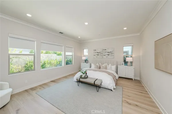 a spacious bathroom with a double vanity sink a mirror and a bathtub