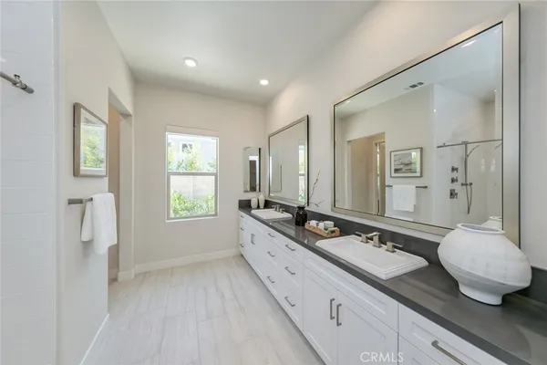 a bathroom with a shower and a glass door