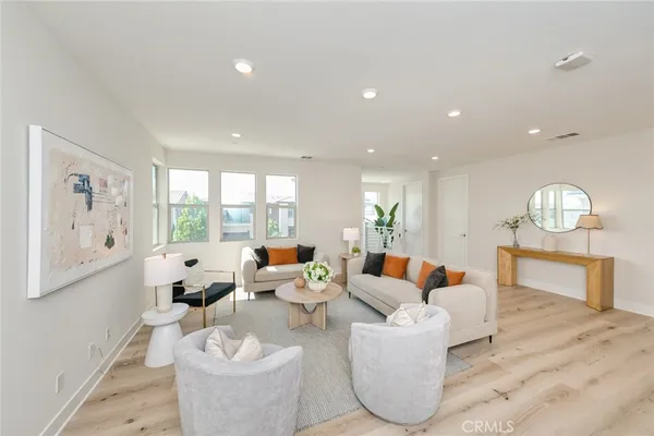 a spacious bedroom with two beds and a large window