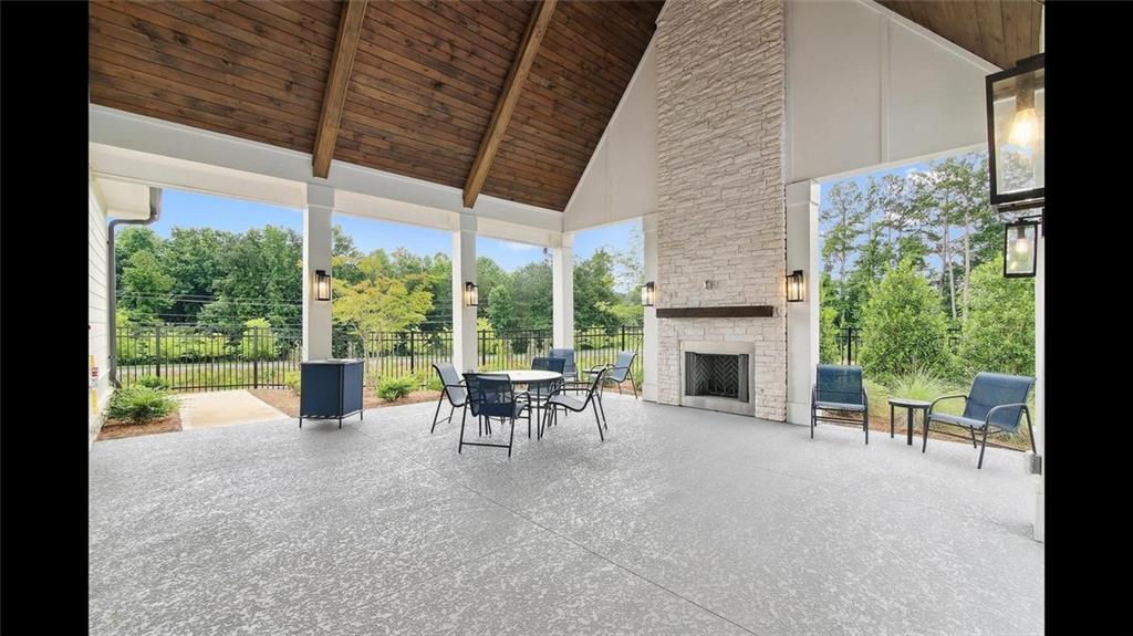 3792 Oak Rdg Drive, Unit HASTINGS Buford, GA 30519 - Photo 2 of 32 a view of a porch with chairs and backyard