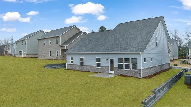 a view of a house with a backyard