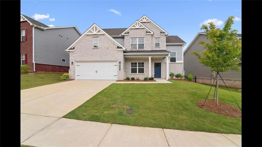 3792 Oak Rdg Drive, Unit HASTINGS Buford, GA 30519 - Photo 5 of 32 a front view of house with garden