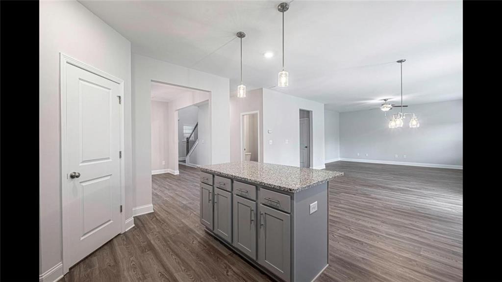 3792 Oak Rdg Drive, Unit HASTINGS Buford, GA 30519 - Photo 6 of 32 a spacious bathroom with a granite countertop sink a mirror and shower