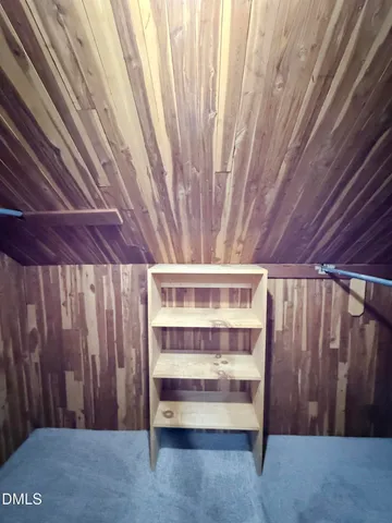 an empty room with a empty space and windows