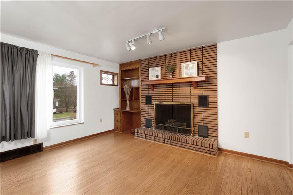 112 Washington Avenue Midway, PA 15060 - Photo 12 of 33 a view of a livingroom with a fireplace and window