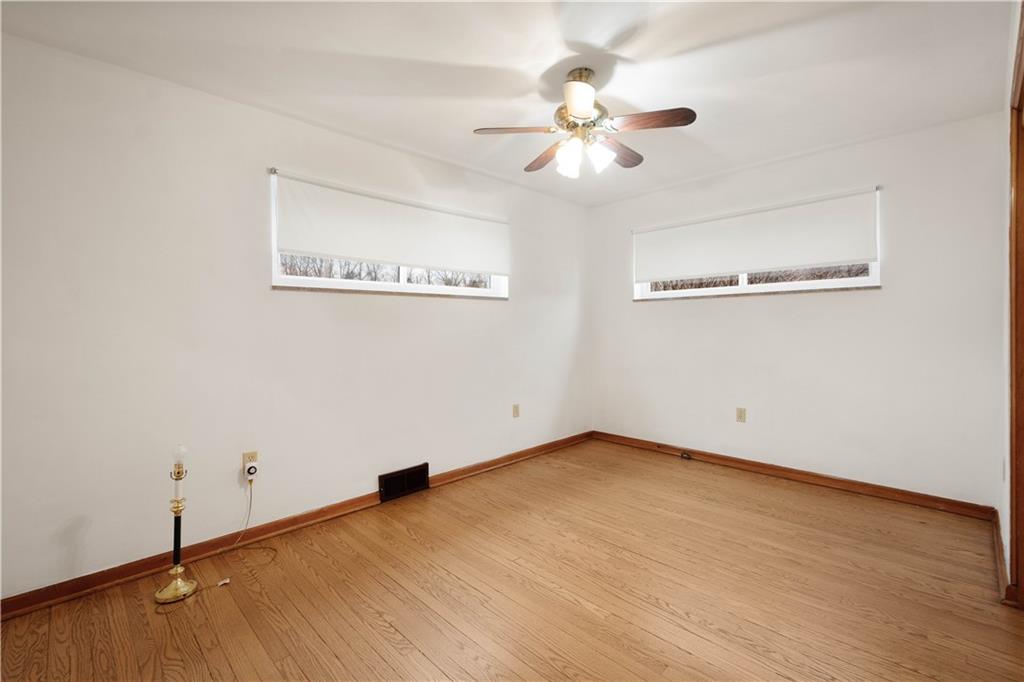 112 Washington Avenue Midway, PA 15060 - Photo 19 of 33 wooden floor in an empty room with a window