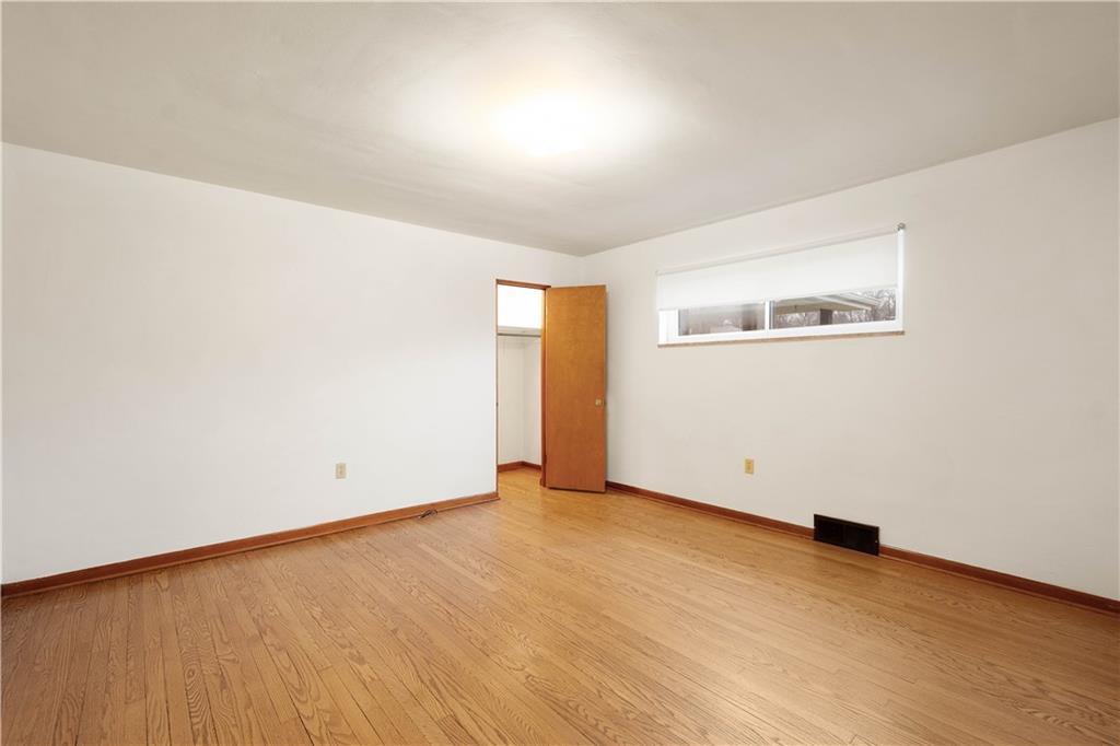112 Washington Avenue Midway, PA 15060 - Photo 21 of 33 an empty room with wooden floor and windows