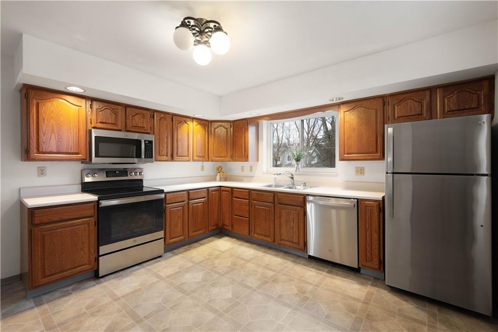 112 Washington Avenue Midway, PA 15060 - Photo 5 of 33 a kitchen with granite countertop stainless steel appliances a refrigerator microwave and sink