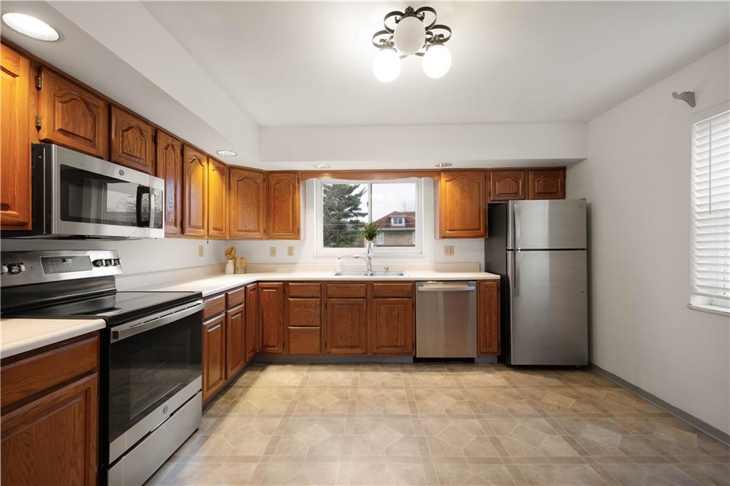 112 Washington Avenue Midway, PA 15060 - Photo 6 of 33 a large kitchen with a refrigerator and a sink