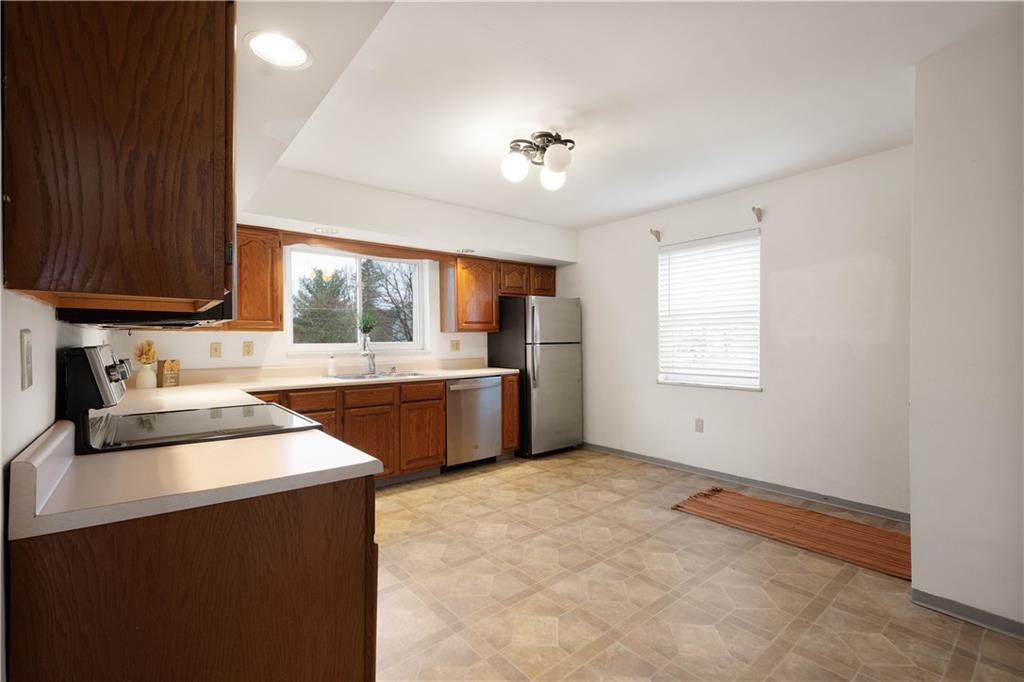 112 Washington Avenue Midway, PA 15060 - Photo 8 of 33 a kitchen with stainless steel appliances a sink stove and cabinets
