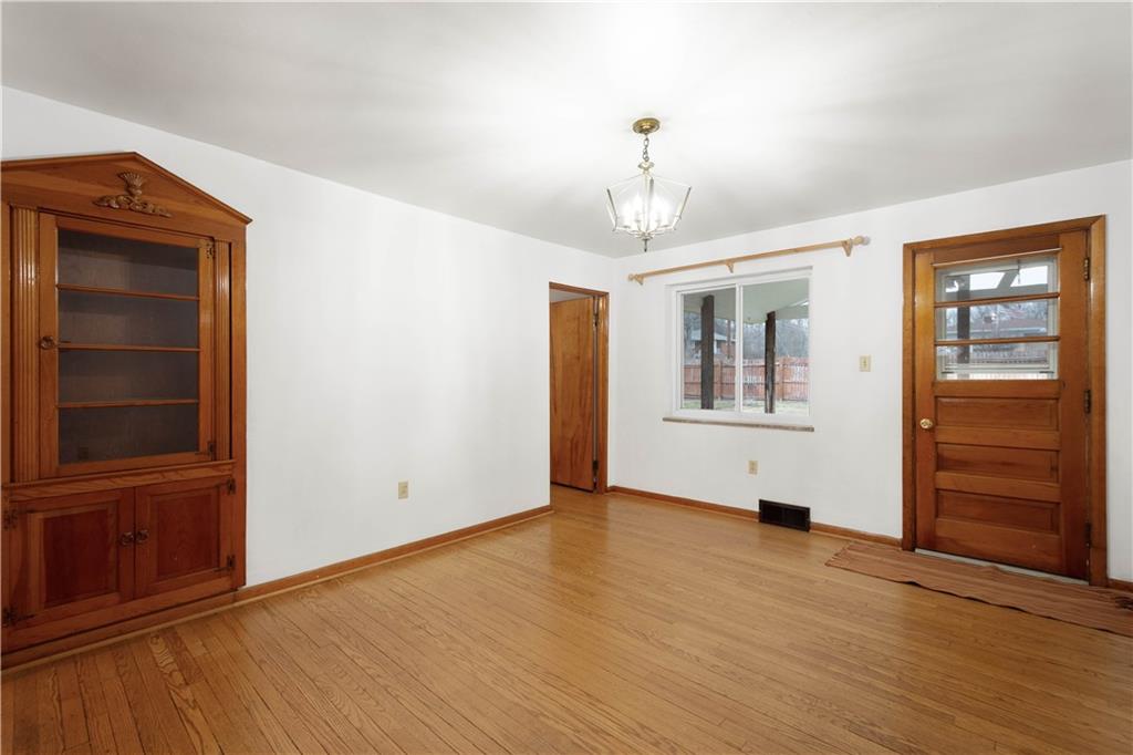 112 Washington Avenue Midway, PA 15060 - Photo 9 of 33 a view of empty room with wooden floor and fan