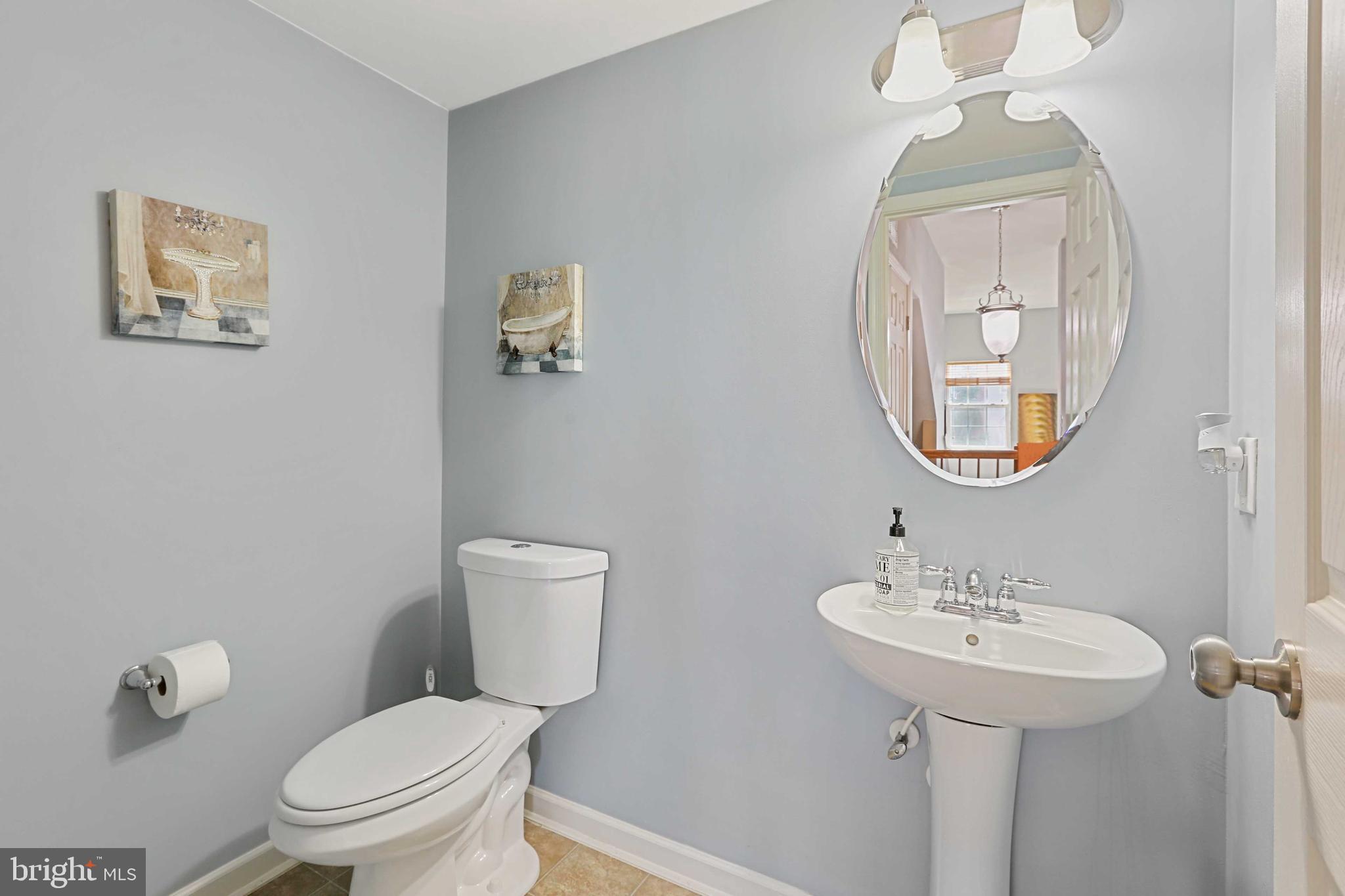 7209 Darby Downs, Unit 7209 Elkridge, MD 21075 - Photo 10 of 19 a bathroom with a toilet a sink and mirror