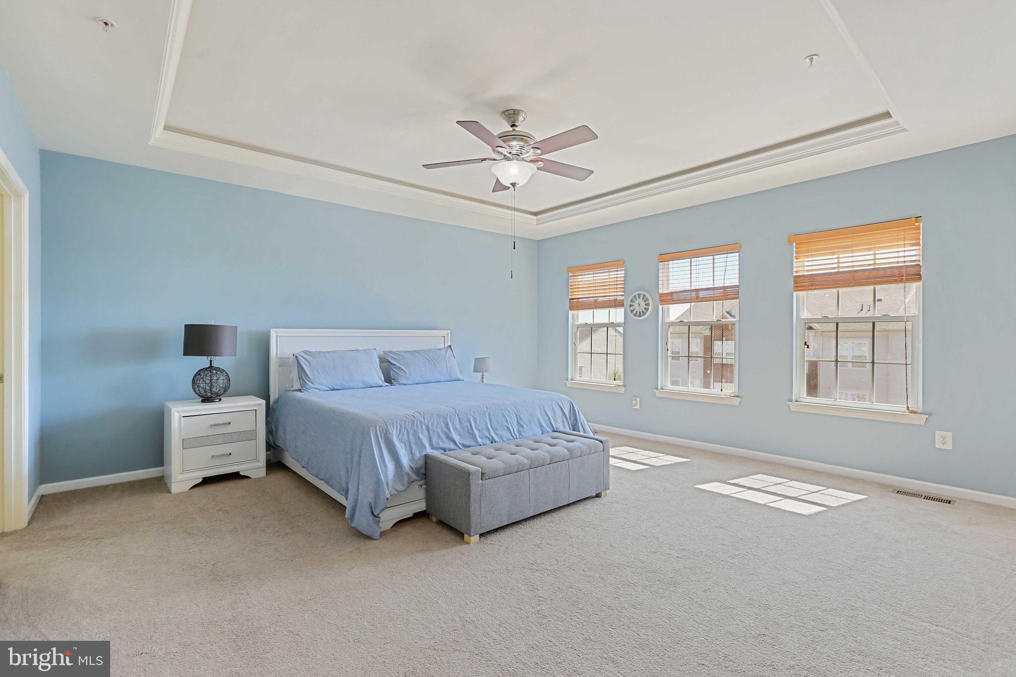 7209 Darby Downs, Unit 7209 Elkridge, MD 21075 - Photo 11 of 19 a spacious bedroom with a bed and a window